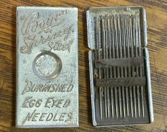 Vtg Boye Spring Steel Burnished Egg Eyed Needles in Metal Slide Box Container