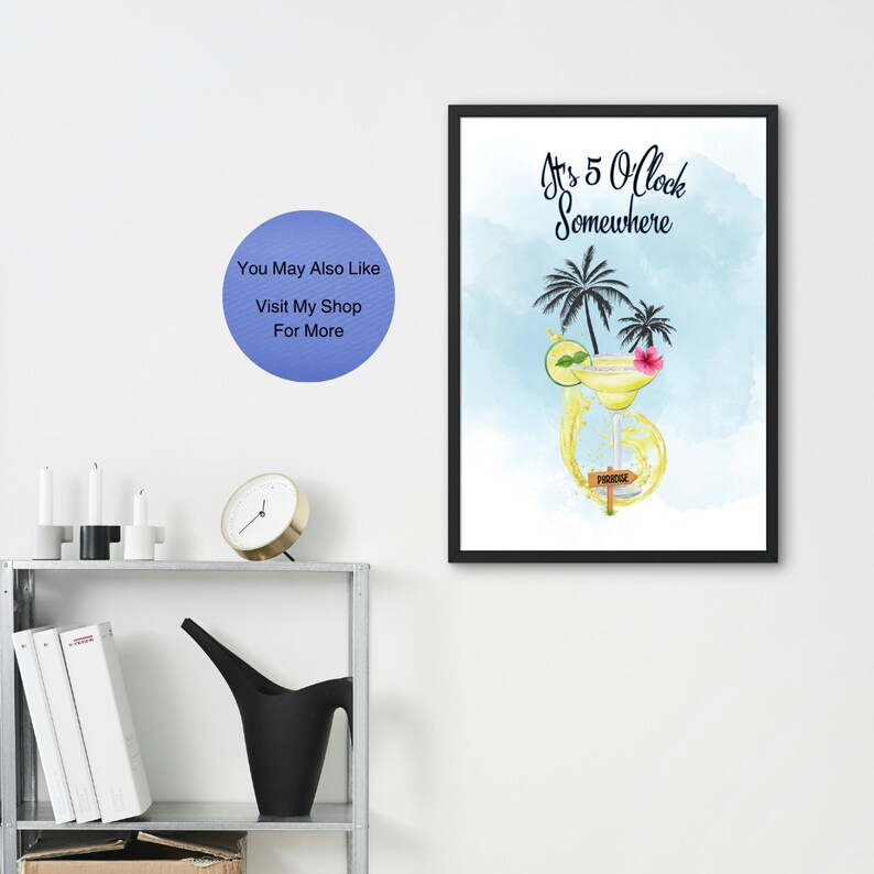 May include: A framed print with a watercolor illustration of a margarita cocktail with a lime wedge and a flower. The text "It's 5 O'clock Somewhere" is written in black above the cocktail. A wooden sign with the word "Paradise" is in the bottom right corner of the image.