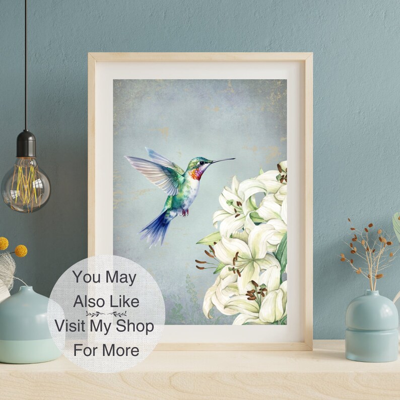 May include: A watercolor painting of a hummingbird in flight with white lilies. The hummingbird is green, blue, and red. The background is a light blue with a textured look.