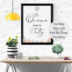 May include: A framed print with the text "The Ocean made me Salty" in black cursive font. A starfish and seashells are depicted in the bottom corner. The print is on a white background and has a black frame. The text "You May Also Like Visit My Shop For More" is on a white background with a gray linen texture.