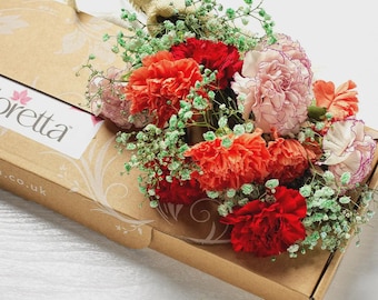 Fresh flowers, complete with a personalised hand written card.