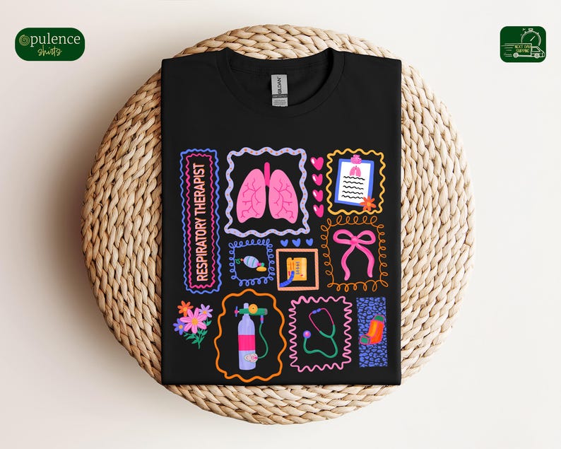 May include: Black t-shirt featuring colorful illustrations related to respiratory therapy. The design includes images of lungs, a stethoscope, flowers, and the text "RESPIRATORY THERAPIST" in a neon-style font. The shirt is displayed on a woven surface.