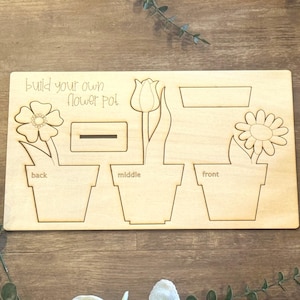 May include: A set of three ceramic mugs with a speckled, matte finish. The mugs are in cream, light grey, and dark grey. Each mug has a simple, minimalist design, ideal for coffee or tea.