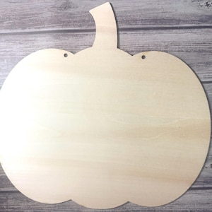 Unfinished Wood Pumpkin Door Hanger: 12&quot; DIY Fall Craft Blank