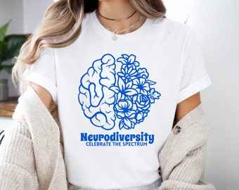 May include: White t-shirt with a blue outline of a brain and flowers. The text "Neurodiversity Celebrate the Spectrum" is printed below the image.