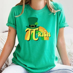 May include: A green t-shirt with a rainbow and a leprechaun hat with the text "Pi-rish" on it.