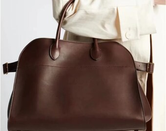 Borse firmate da donna: borse a tracolla, da ufficio e da viaggio, oltre a portafogli in pelle: regali perfetti per lei
