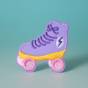 May include: Purple and yellow embroidered roller skate patch with a pink lightning bolt and pink wheels.