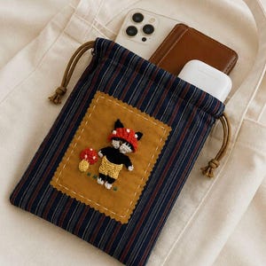 3D Embroidered Amigurumi, Relaxing Cat Wearing a Mushroom Hat Drawstring Pouch, Handmade