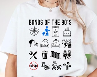 May include: White t-shirt with the text "Bands of the 90's" above a series of black and blue graphic icons. The icons include a box, a person with luggage, a calendar, a cake, and other symbols.