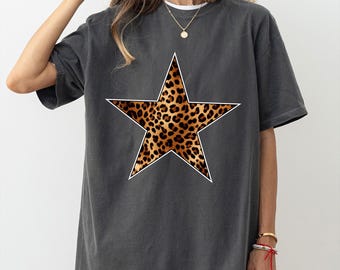 May include: A charcoal gray oversized t-shirt with a large white outline of a star filled with a leopard print pattern.