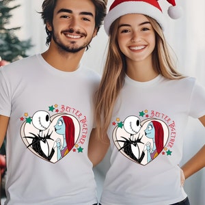 May include: Two white t-shirts with a graphic of Jack Skellington and Sally from The Nightmare Before Christmas. The graphic is inside a heart with stars and the text "Better Together".