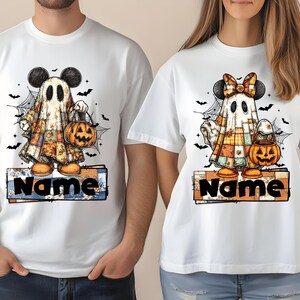May include: White t-shirts featuring a Halloween ghost design. The ghost wears a patchwork quilt and Mickey Mouse ears, holding a jack-o'-lantern. The word "Name" is printed on a sign at the bottom. Bats and spiderwebs complete the design.