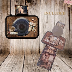 May include: A camera-shaped photo frame with a wood-effect finish, incorporating a lens and travel-themed images. Includes film strip and luggage-shaped photo holders. The word "EXPLORE" is visible on a label.