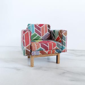 Modern chair dollhouse. Armchair upholstered handmade woven fabric. Colourful 1:12 1/12 blue, red, yellow. Brown wood legs. Modern design