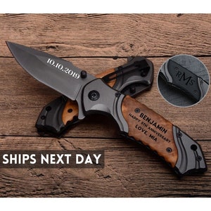 May include: A personalized folding knife with a dark gray blade and a wooden handle. The blade is engraved with "10.10.2019". The handle is engraved with "BENJAMIN HAPPY 5TH ANNIVERSARY LOVE, MIA". A small inset shows "RMS" engraved on the handle.