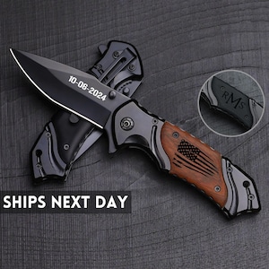 May include: A black folding knife with a wood handle and a US flag design. The blade is engraved with the date 10-06-2024. The knife is closed and the handle is visible.
