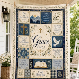 May include: A quilted throw blanket featuring a central panel with the word Grace, a cross, and floral borders. Surrounding panels display religious text, a dove, an open Bible, mountains, and a cross, all in shades of navy blue, cream, and gold.