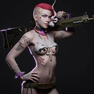 May include: A woman with pink hair and a bandanna is holding a large black and green rifle. She is wearing a white tank top with a skull and crossbones design, a black choker necklace, and a black belt with the word "TANK" on it. She has a tattoo on her left arm that says "Drug Life" and a heart with the word "TRUE" inside. She is also wearing a bandage on her forehead.