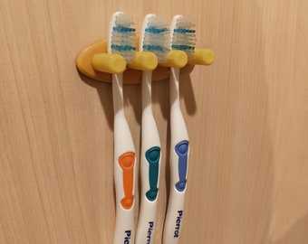 Soporte de pared para cepillos de dientes