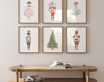 May include: Six framed watercolor illustrations featuring a Nutcracker, a Christmas tree, a mouse, and ballerinas. The illustrations are in a whimsical style with gold accents.