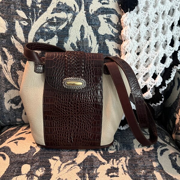 Brighton bucket shoulder bag, No 759985  Two-toned brown croc pattern and cream colored soft pebbled leather. 9.5”T x 9”W, 15” strap drop.