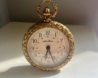 Beautiful antique clock by Seth Thomas. Small, 5”T x 3.25”W standing clock. Ornate gold frame. MCM. Regency. Romantic.