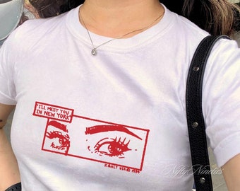 May include: White t-shirt with a red graphic of a pair of eyes and the text "I'll meet you in New York" and "SALT VIA HR".