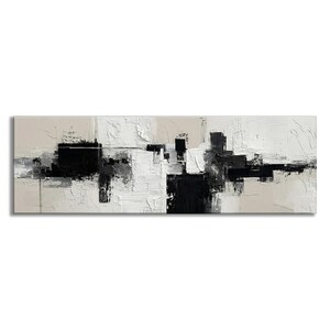 May include: Abstract art canvas print featuring a textured, monochromatic design. The artwork uses black, white, and gray brushstrokes on a beige background. The rectangular canvas is a long, horizontal shape, suitable for a modern living space.
