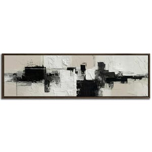 May include: Abstract art painting in a rectangular, dark brown wooden frame. The artwork features a textured, layered design with black, white, and beige tones. The composition is a modern, geometric arrangement of shapes and brushstrokes.