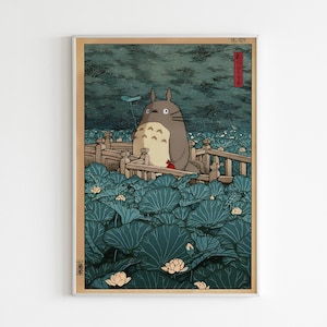 May include: A framed art print depicting Totoro on a wooden bridge amidst teal lily pads. The background is a dark, textured sky. The print is in a vintage woodblock style, reminiscent of traditional Japanese art.