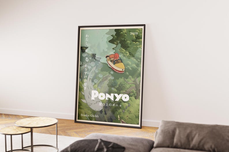May include: Framed poster featuring a scene from the animated film "Ponyo." The artwork depicts a boat with two characters sailing through a green, forested environment. The title "Ponyo" is prominently displayed, along with Japanese text and the Studio Ghibli logo.