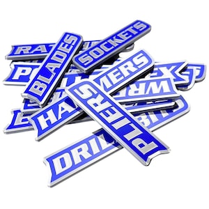 May include: A collection of blue and silver tool labels, including "BLADES", "SOCKETS", and "PLIERS". The labels are rectangular with a curved design and feature white lettering. The tools are likely for automotive or mechanical use.