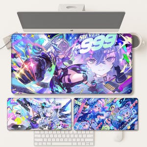 May include: A vibrant, colorful desk mat featuring anime-style artwork. The design includes a central image of a character with the number "999" and additional smaller mats with similar illustrations. A keyboard and mouse are visible.