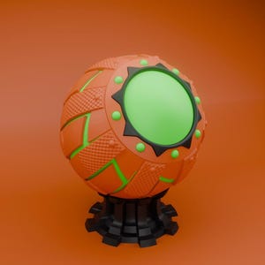 May include: An orange and green spherical object with a black base. The sphere has a textured surface with green accents and a central green circle. The base is black and has a gear-like design. The background is a solid orange color.
