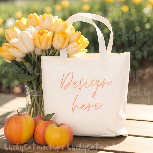 Tote Bag Mockup with peaches and yellow tulip flower bouquet next to white blank cotton canvas tote bag for sunny summer styled tote designs