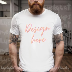 May include: A white t-shirt with the text "Design here" in pink and orange lettering.