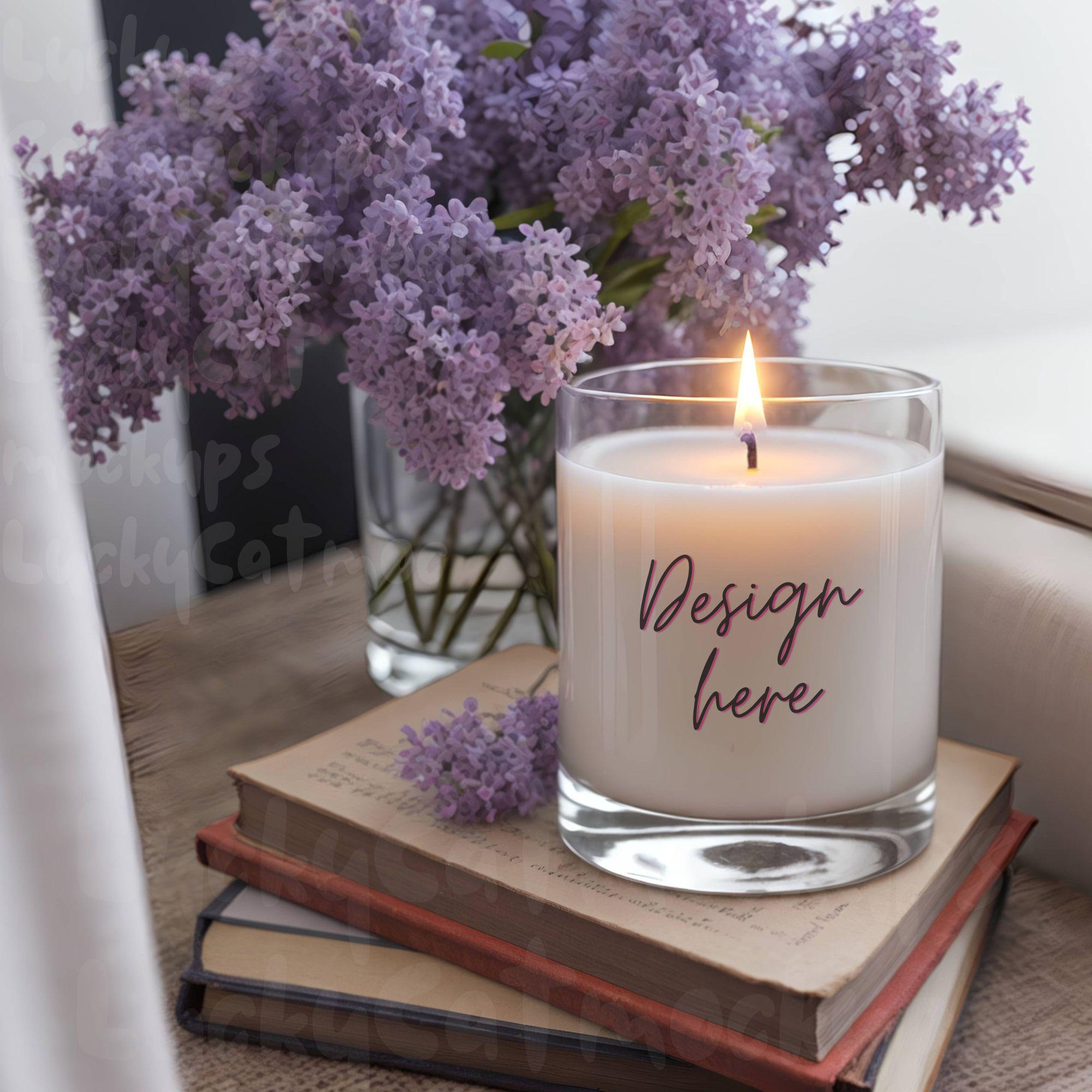 Candle Mockup Styled on books with purple lilac flowers next to window for luxury scented designer gift candle label design display