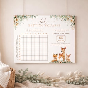 May include: A baby betting squares game board with a grid for numbers 0-9. The board has floral accents and illustrations of a fox, deer, and rabbit. Text includes "Baby Betting Squares" and instructions for a 50/50 game.