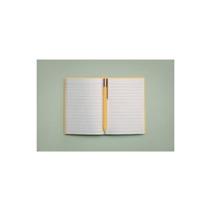 May include: An open notebook with lined pages and a yellow pen. The notebook has a yellow border and is open on a light green surface. The text "NOTES" and "Daily Notes & Thoughts" is at the top.