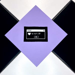 May include: A black square with a white-bordered error message that reads "ERROR" and "Your heart is full" with a heart icon. The square is centered on a lavender diamond, set against a black and white tiled background.