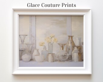 May include: A framed print of a still life featuring a variety of glass and ceramic vases, some with flowers, arranged on a shelf. The vases are in shades of white, silver, and grey, and the flowers are white.