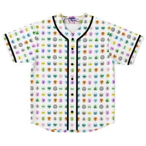 May include: White baseball jersey with a colorful pattern of circular designs. The jersey has a black trim on the collar, sleeves, and button placket. The pattern includes various colors like blue, green, purple, and orange.