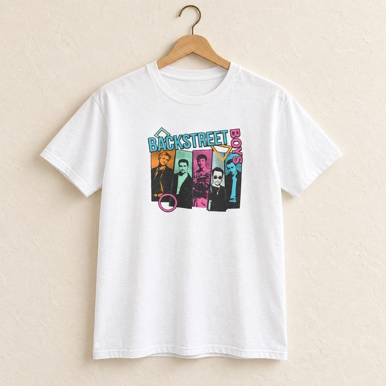 May include: A white short-sleeve t-shirt featuring a graphic print of the Backstreet Boys. The design includes five individual portraits of the band members in colorful rectangular frames, accented by geometric shapes and the text Backstreet Boys.