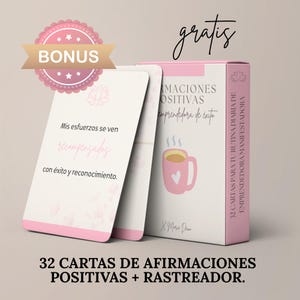 May include: A set of 32 affirmation cards for entrepreneurs, in a pink and white design. The cards feature Spanish affirmations, with a bonus offer and the word "gratis" (free). The box includes a graphic of a mug.