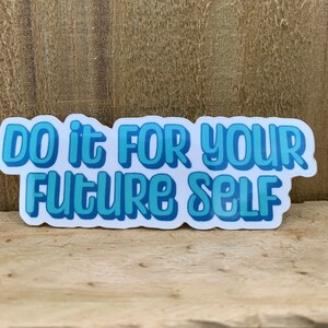 May include: A white sticker with blue lettering that reads "Do it for your future self".