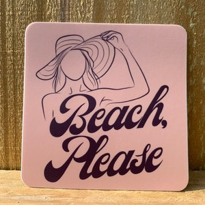 May include: Pink square sticker with a black line drawing of a person wearing a large sun hat. The text "Beach, Please" is written in a stylized font.