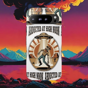May include: A white smartphone case featuring a graphic of a skeleton cowboy being abducted by a UFO. The design includes a desert landscape with cacti, a sunburst background, and the text "ABDUCTED AT HIGH NOON" printed in black lettering.