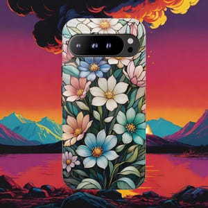 May include: A floral phone case featuring a vibrant design of colorful flowers in shades of pink, blue, and white against a dark green background. The case has a sleek, modern design with a camera cutout.