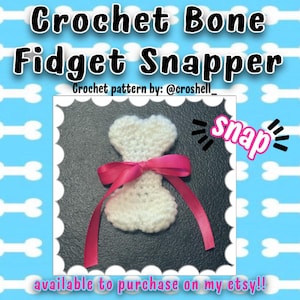 May include: A white crocheted bone-shaped fidget snapper adorned with a bright pink satin ribbon tied in a bow. The text Crochet Bone Fidget Snapper, Crochet pattern by: @croshell_, snap, and available to purchase on my etsy!! are visible.